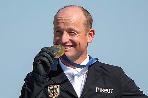 Michael Jung celebrates his gold in Equestrian Jumping